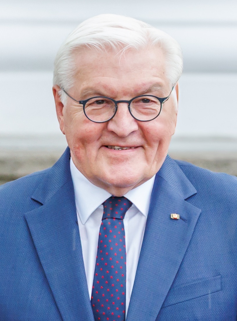 Portrait of Frank-Walter Steinmeier, Federal President of Germany, smiling, in a blue suit and red-dotted tie