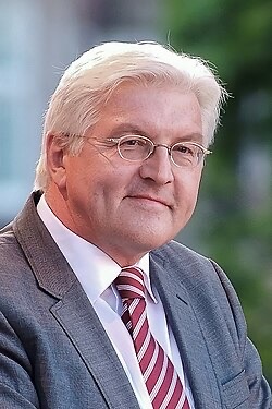 Frank-Walter Steinmeier in 2009, wearing glasses, a grey suit and a striped red tie
